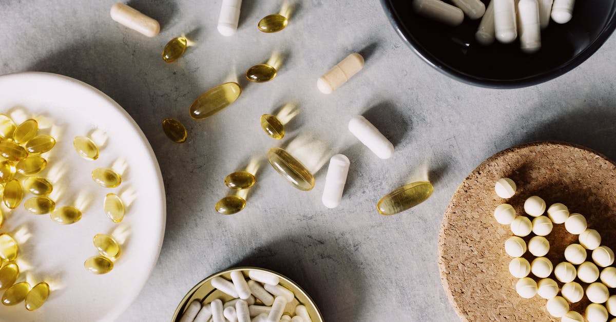 How to prevent the silver utensils from tarnishing? - Assorted vitamins placed in diverse utensil on gray board