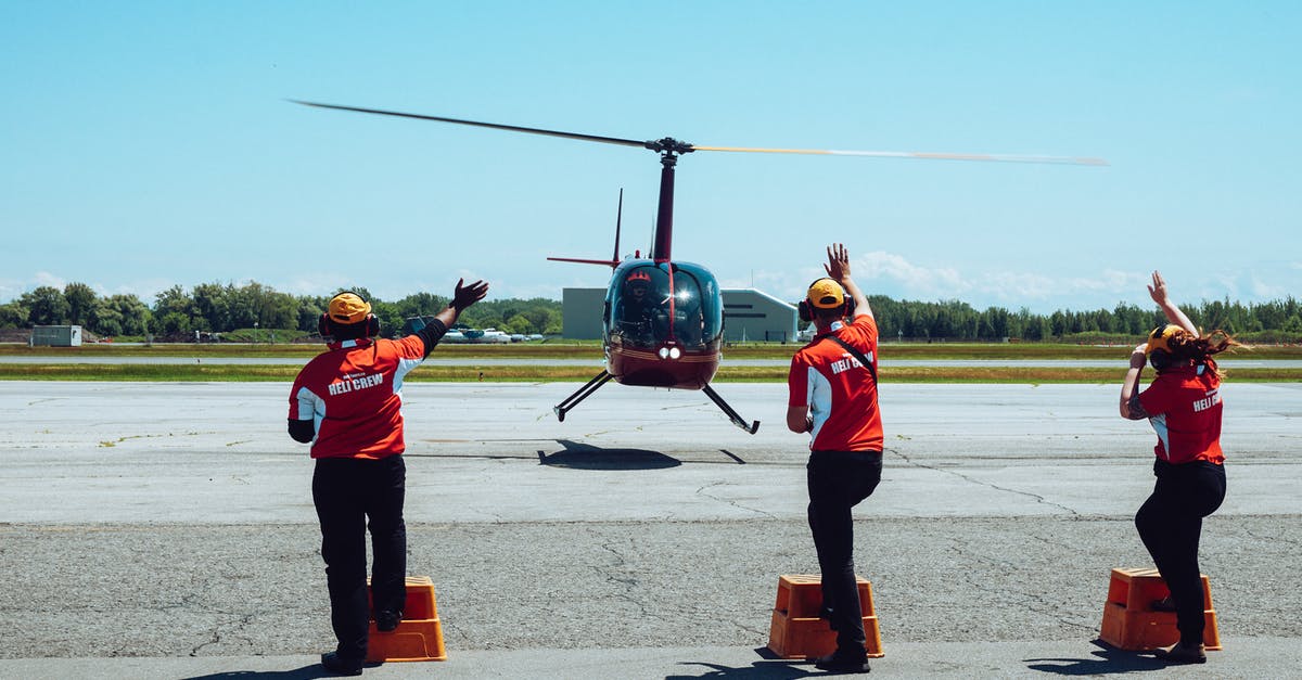 How to raise the setting and melting point of gelatin - Back view of anonymous ground crews in uniforms and headsets meeting passenger helicopter on airfield after flight against cloudless blue sky How to raise the setting and melting point of gelatin - Back view of anonymous ground crews in uniforms and headsets meeting passenger helicopter on airfield after flight against cloudless blue sky