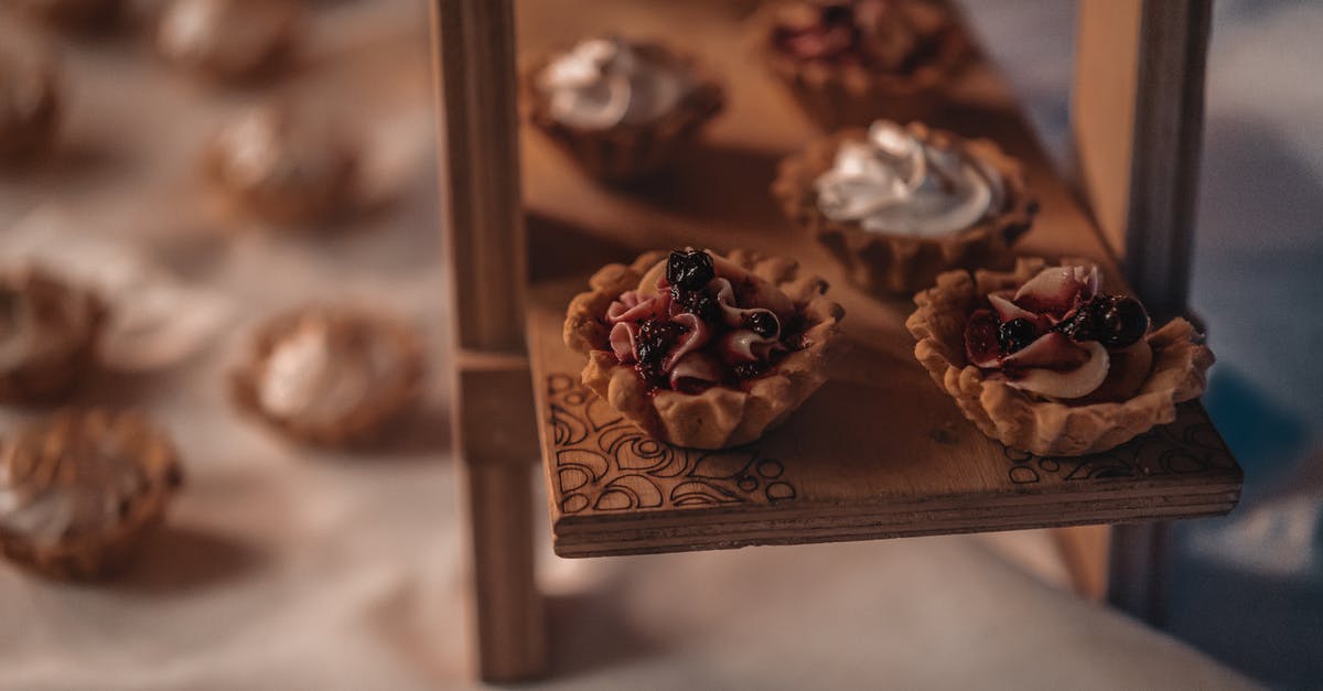 How to recover jam that has set too hard? - Sweet desserts placed on wooden stand at event How to recover jam that has set too hard? - Sweet desserts placed on wooden stand at event