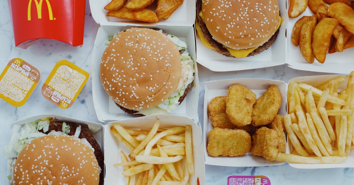 How to recreate the sauce in McDonald's 1955 Burger? - Top view flat lay of junk food including burgers with french fries and nuggets placed on marble table How to recreate the sauce in McDonald's 1955 Burger? - Top view flat lay of junk food including burgers with french fries and nuggets placed on marble table