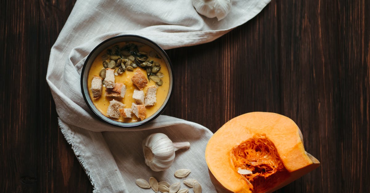 How to reduce the intensity of garlic in a soup? - Pumpkin Soup in Black Ceramic Bowl How to reduce the intensity of garlic in a soup? - Pumpkin Soup in Black Ceramic Bowl
