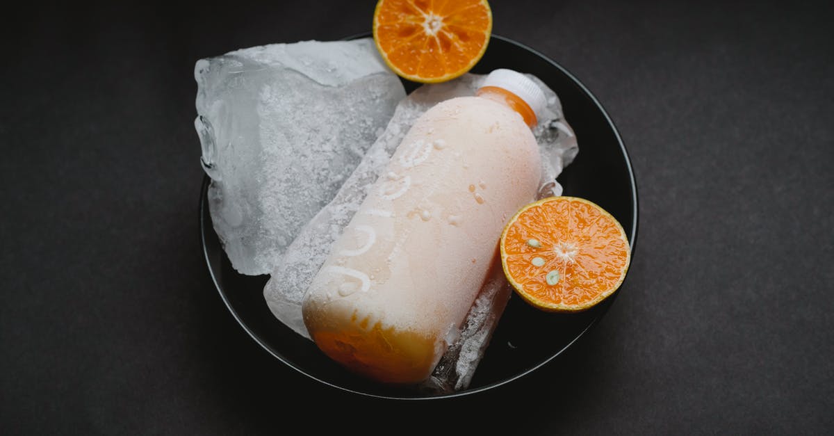 How to refresh a frozen bagel - Bottle with orange juice on plate How to refresh a frozen bagel - Bottle with orange juice on plate