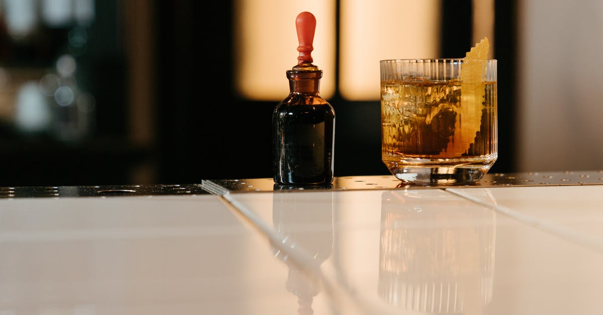 How to re-melt bitter chocolate? - Brown Glass Bottle Beside Clear Drinking Glass How to re-melt bitter chocolate? - Brown Glass Bottle Beside Clear Drinking Glass