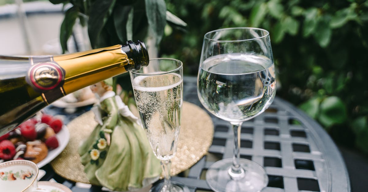 How to remove alcohol taste from vanilla extract? - From above of unrecognizable person pouring sparkling wine into elegant crystal glass served on round table near fresh pasties with berries and coffee cups How to remove alcohol taste from vanilla extract? - From above of unrecognizable person pouring sparkling wine into elegant crystal glass served on round table near fresh pasties with berries and coffee cups