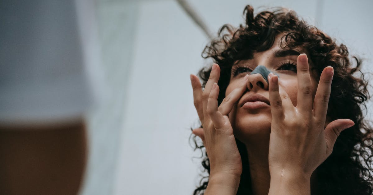 How to remove hardened dough from hair? - Female applying blackhead removing mask on nose How to remove hardened dough from hair? - Female applying blackhead removing mask on nose