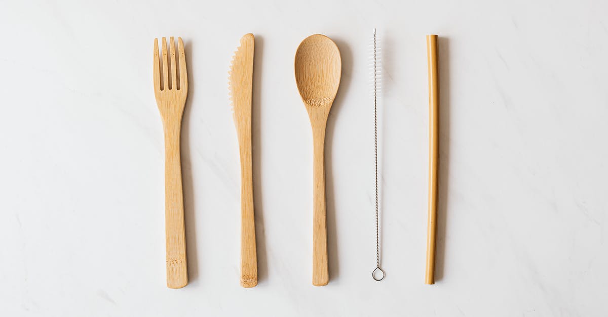 How to remove mould from a wooden spoon - Wooden cutlery and tube with brush on marble table How to remove mould from a wooden spoon - Wooden cutlery and tube with brush on marble table