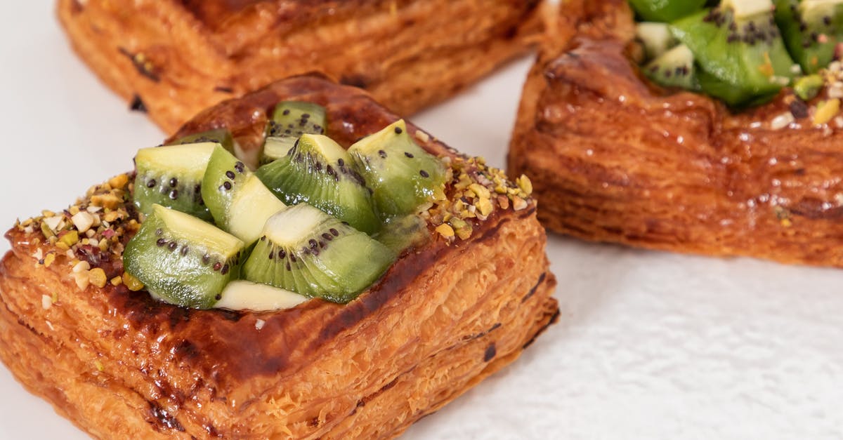 How to replace sugar with dry fruit in a cake recipe? - Closeup of golden baked puff pastries with glazed kiwi cubes and crushed nuts How to replace sugar with dry fruit in a cake recipe? - Closeup of golden baked puff pastries with glazed kiwi cubes and crushed nuts