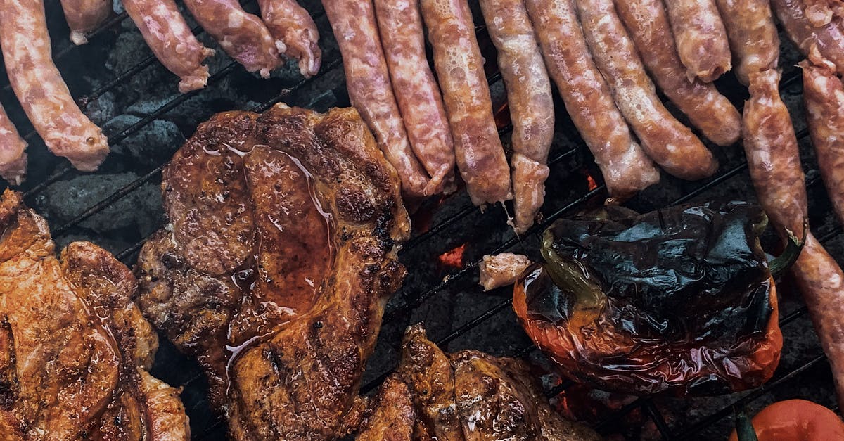How to roast chestnuts on an open fire? - From above yummy steaks and meat sausages roasting on grill grid near organic capsicum during picnic How to roast chestnuts on an open fire? - From above yummy steaks and meat sausages roasting on grill grid near organic capsicum during picnic