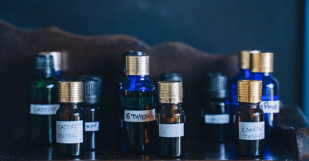 How to safely reuse glass bottles to store oils - Black Glass Bottles on Brown Wooden Shelf How to safely reuse glass bottles to store oils - Black Glass Bottles on Brown Wooden Shelf