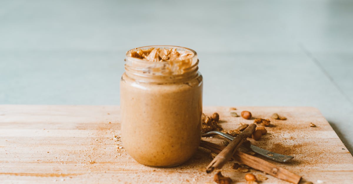 How to salvage hardened peanut butter from jar bottom - Clear Glass Jar With Brown Liquid on Brown Wooden Table How to salvage hardened peanut butter from jar bottom - Clear Glass Jar With Brown Liquid on Brown Wooden Table