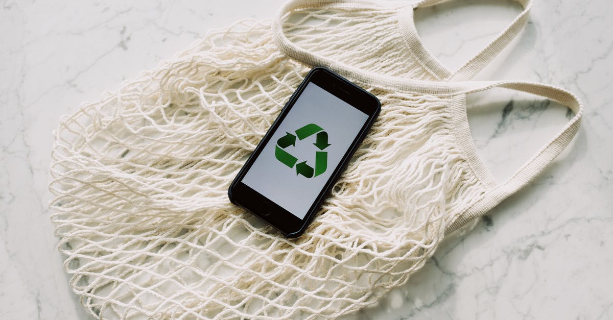 How to save spaghetti squash? - Overhead of smartphone with simple recycling sign on screen placed on white eco friendly mesh bag on marble table in room How to save spaghetti squash? - Overhead of smartphone with simple recycling sign on screen placed on white eco friendly mesh bag on marble table in room