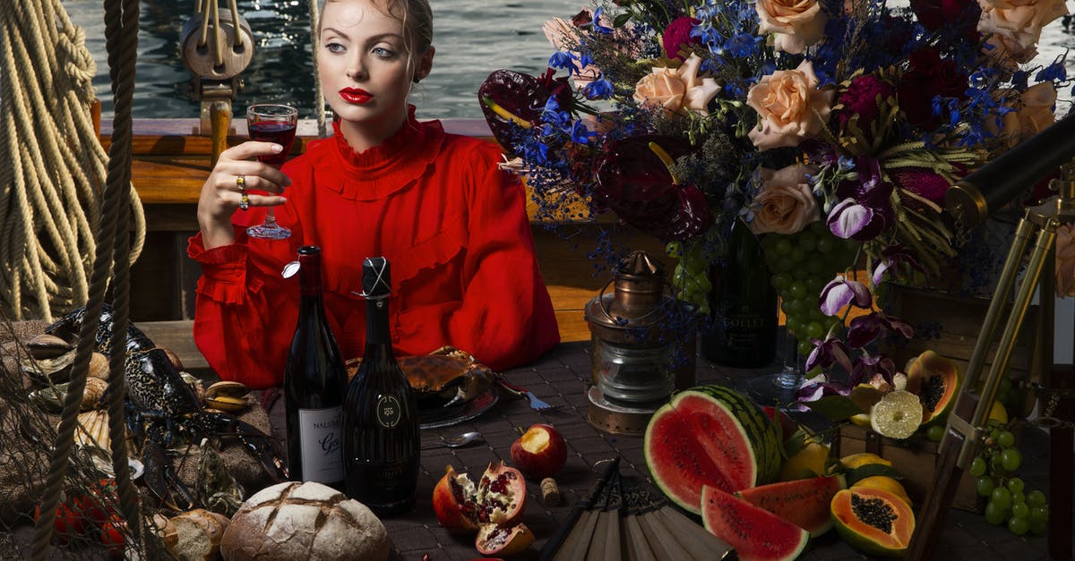 How to ship bread or bread dough? - Serious female with wineglass of alcohol drink in stylish clothes looking away while sitting at table with assorted food on ship How to ship bread or bread dough? - Serious female with wineglass of alcohol drink in stylish clothes looking away while sitting at table with assorted food on ship