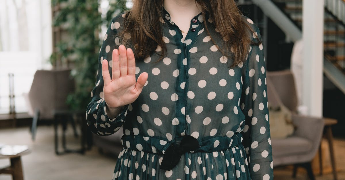 How to stop meatballs falling apart when frying - Crop feminine woman showing stop gesture in modern apartment How to stop meatballs falling apart when frying - Crop feminine woman showing stop gesture in modern apartment