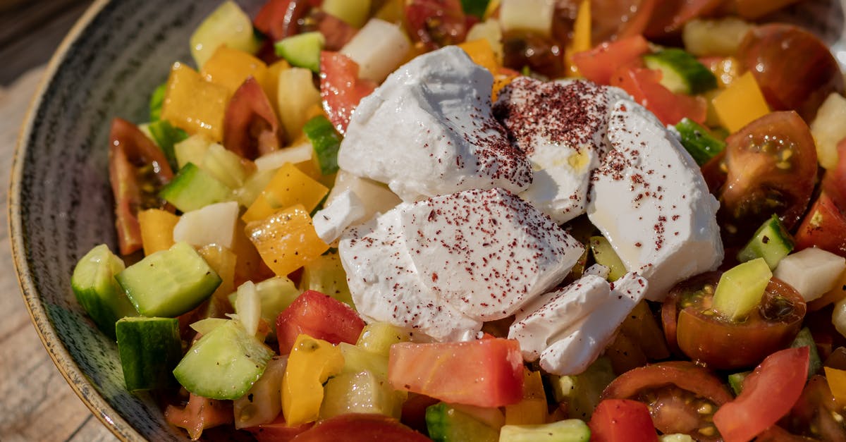 How to stop oil separating from cheese - From above of appetizing fresh healthy vegetable salad with tomatoes and cucumber and sweet yellow pepper decorated with pieces of mozzarella cheese served on ceramic gray plate How to stop oil separating from cheese - From above of appetizing fresh healthy vegetable salad with tomatoes and cucumber and sweet yellow pepper decorated with pieces of mozzarella cheese served on ceramic gray plate