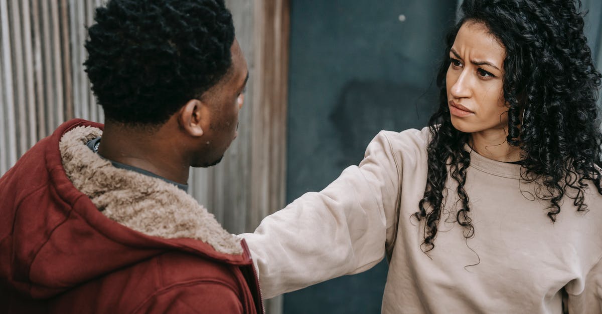 How to stop oil separating from cheese - Unhappy multiethnic couple on street How to stop oil separating from cheese - Unhappy multiethnic couple on street