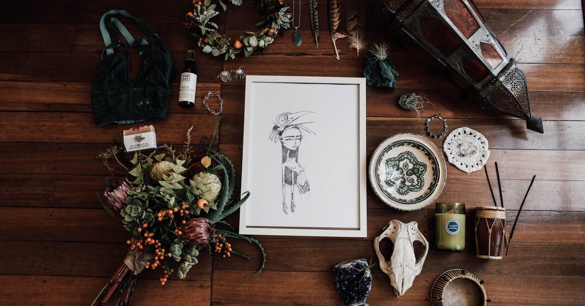 how to take away the dead animal taste/smell from meat? - Top view of frame with illustration among flower bouquet and lantern near amulets on wooden surface