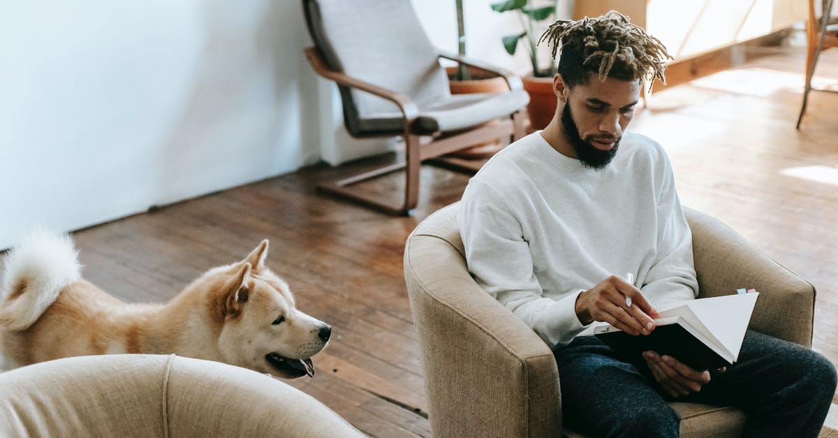 how to take away the dead animal taste/smell from meat? - Black man with notebook near dog