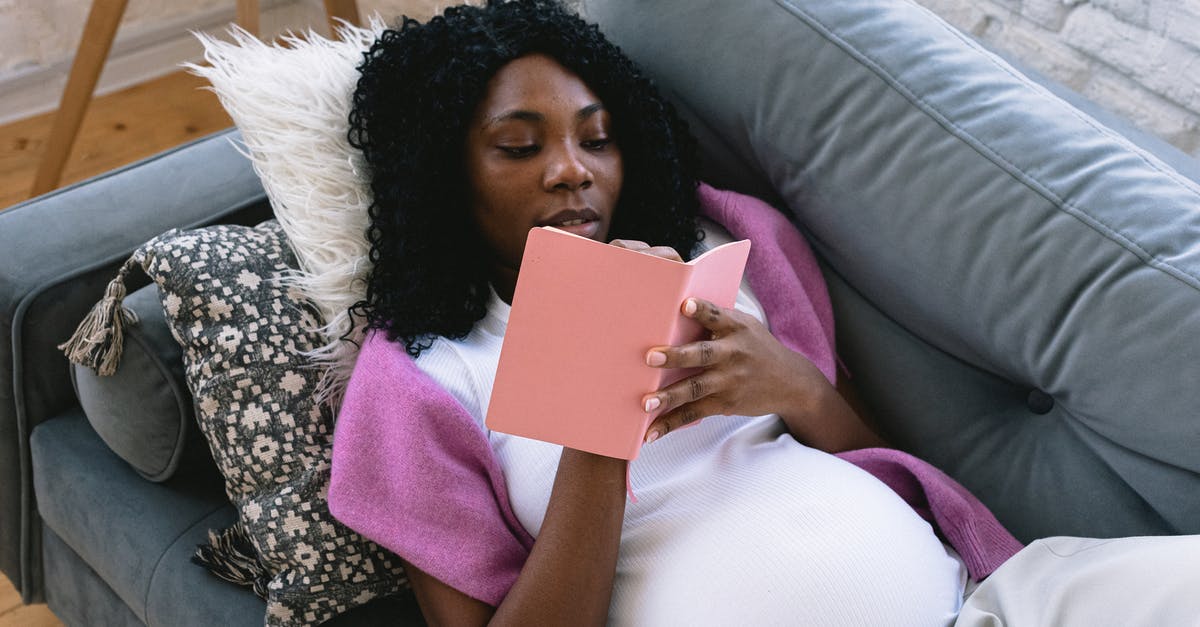 How to take care of glazed earthenware? - From above of focused pregnant African American female taking notes in notepad while resting on comfortable sofa in living room How to take care of glazed earthenware? - From above of focused pregnant African American female taking notes in notepad while resting on comfortable sofa in living room