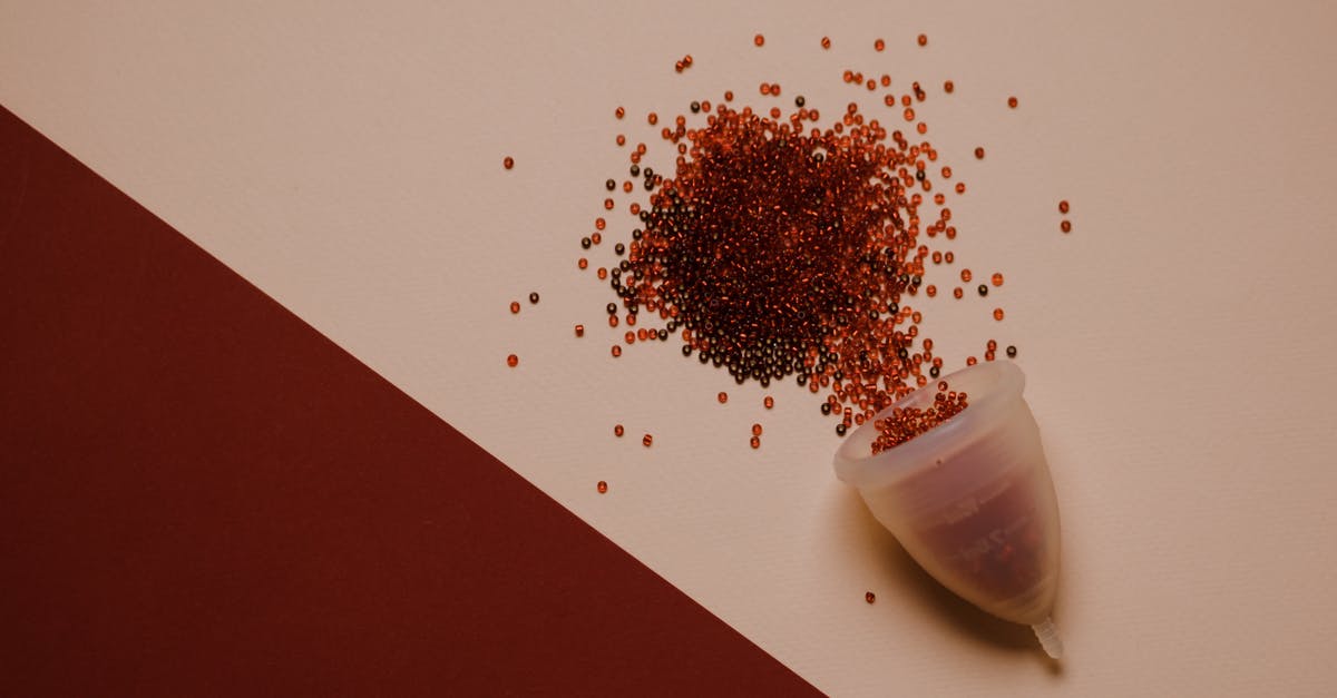 How to take care of Silicone cookware - Top view of silicone menstrual cup with red beads scattered on pink surface How to take care of Silicone cookware - Top view of silicone menstrual cup with red beads scattered on pink surface