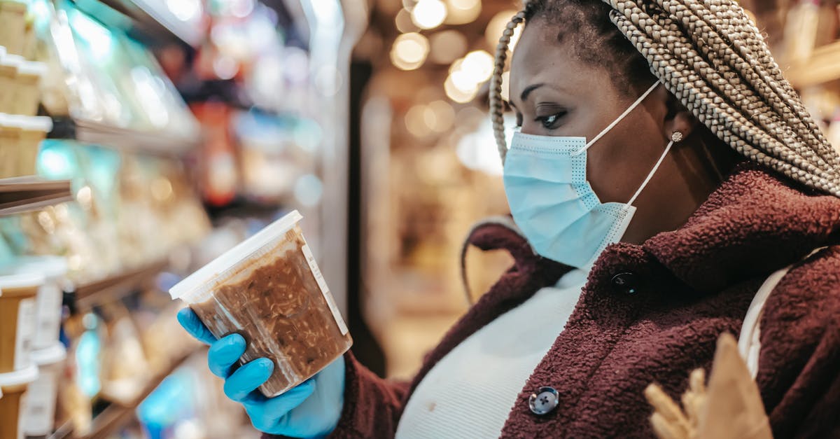 How to tell if frozen mussels are good? - Black woman checking ingredients and manufacturing date of product