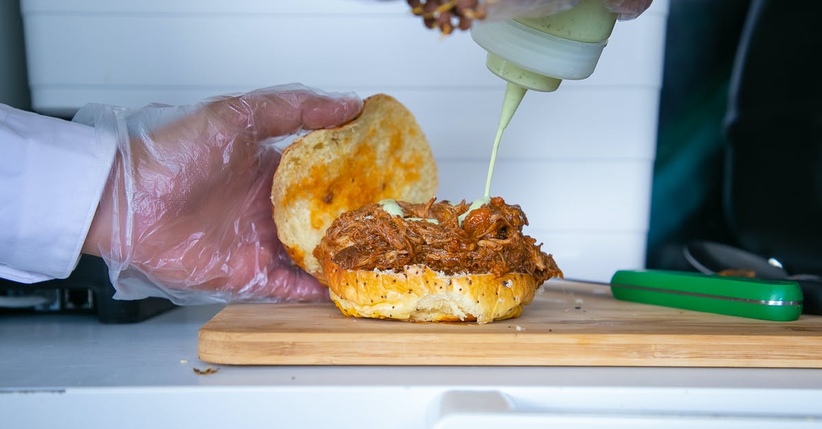 How to tell when a turkey burger is fully cooked? - Crop anonymous male cook pouring mayonnaise sauce from bottle to fried pulled pork on bun in kitchen How to tell when a turkey burger is fully cooked? - Crop anonymous male cook pouring mayonnaise sauce from bottle to fried pulled pork on bun in kitchen