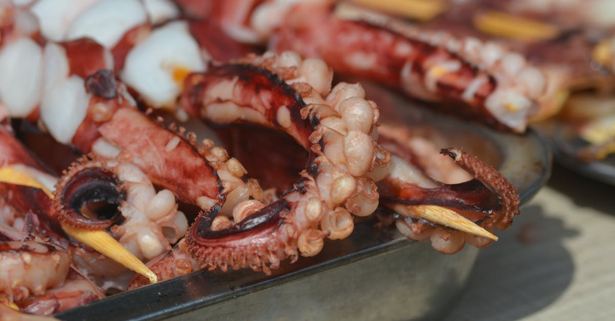 How to tenderize squid for ika nigiri? - Close-Up Photograph of Skewered Tentacles How to tenderize squid for ika nigiri? - Close-Up Photograph of Skewered Tentacles