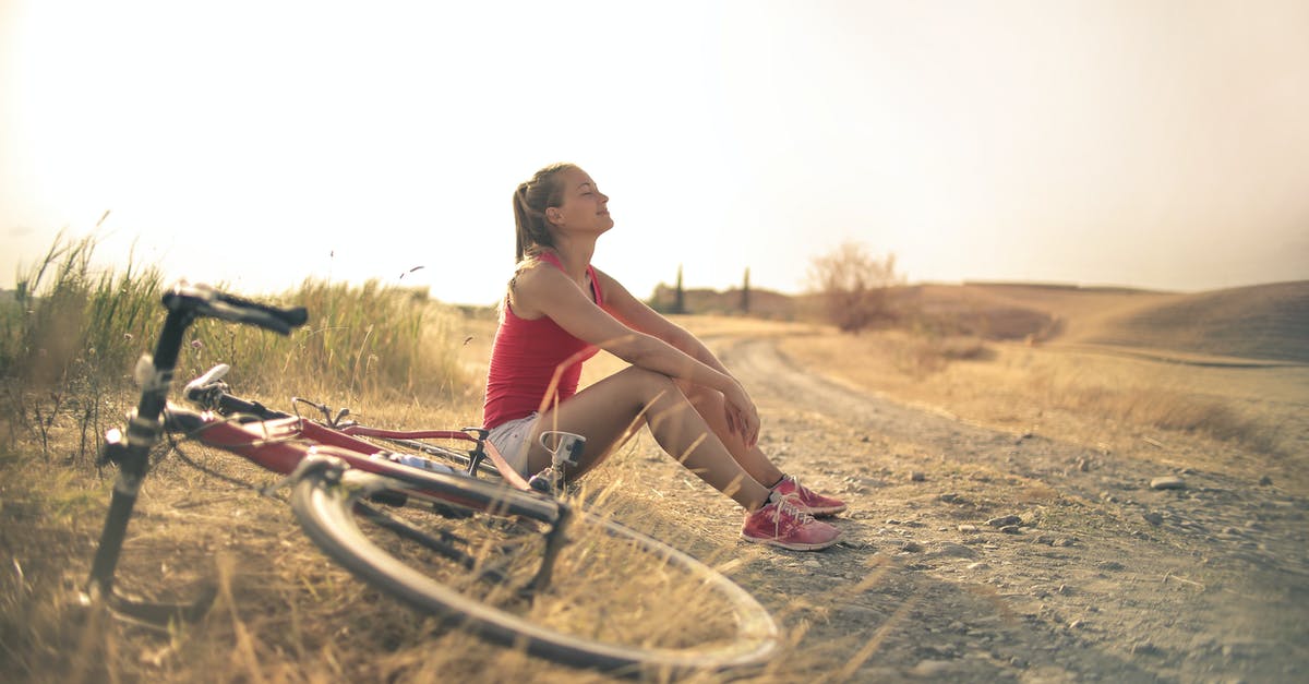 How to transport fresh ravioli to office potluck? - Full body of female in shorts and top sitting on roadside in rural field with bicycle near and enjoying fresh air with eyes closed How to transport fresh ravioli to office potluck? - Full body of female in shorts and top sitting on roadside in rural field with bicycle near and enjoying fresh air with eyes closed