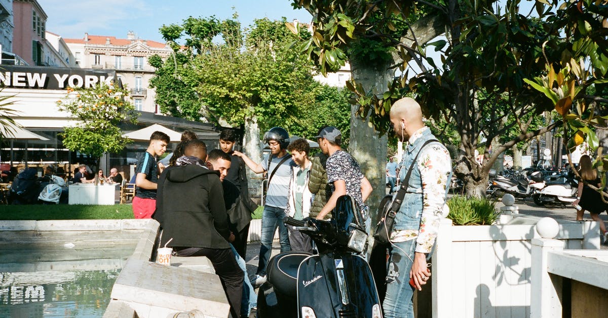 How to transport several pies? - People Standing Beside Black Motor Scooter