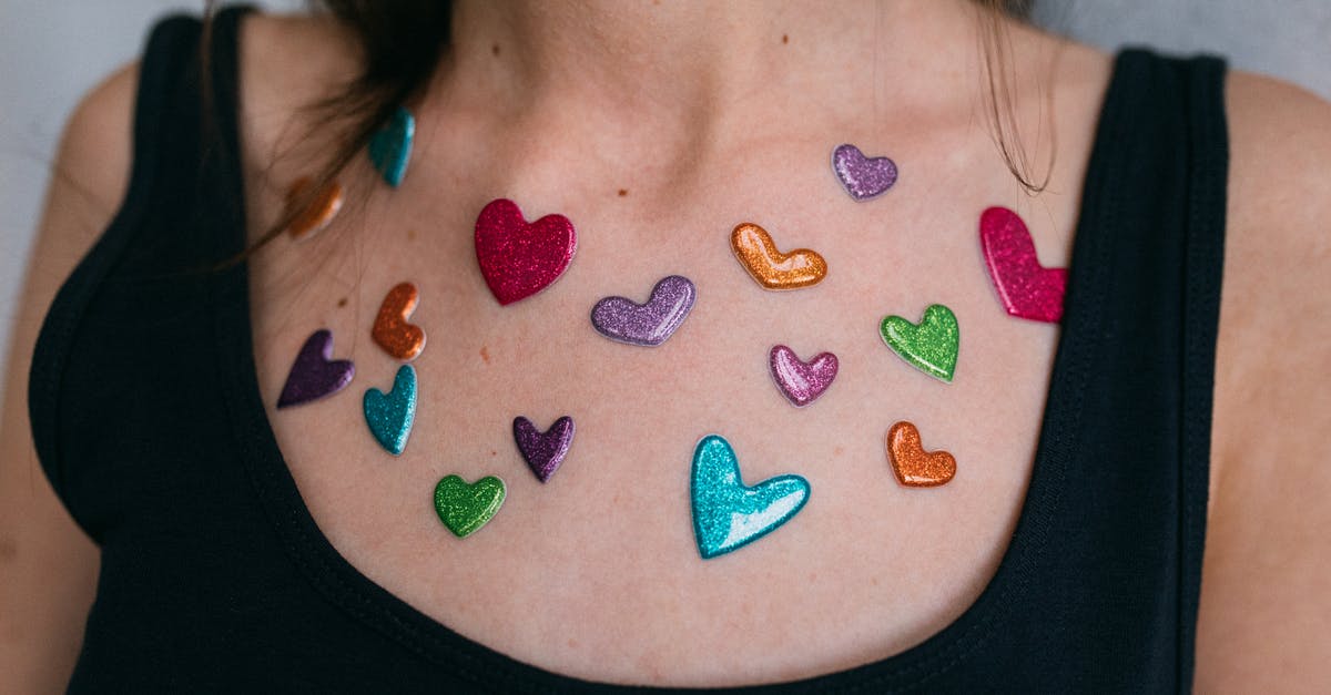 How to un-brine hearts of palm? - Woman in Black Tank Top With Blue and Red Heart Shaped Pendant Necklace