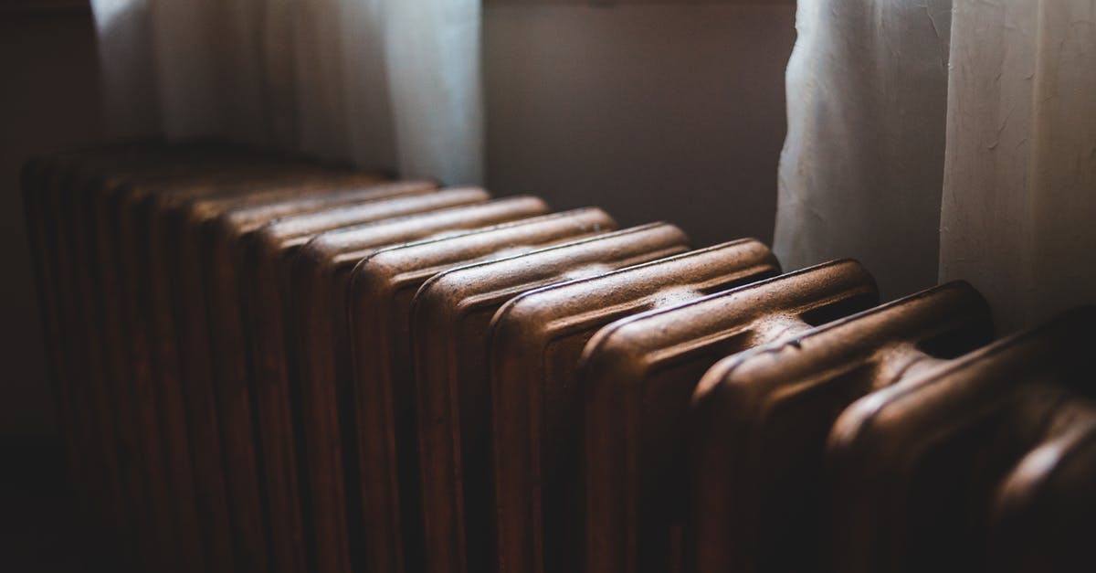 How to use a ridged cast iron griddle? - Aged heating battery made of cast iron near windowsill with curtains in house How to use a ridged cast iron griddle? - Aged heating battery made of cast iron near windowsill with curtains in house