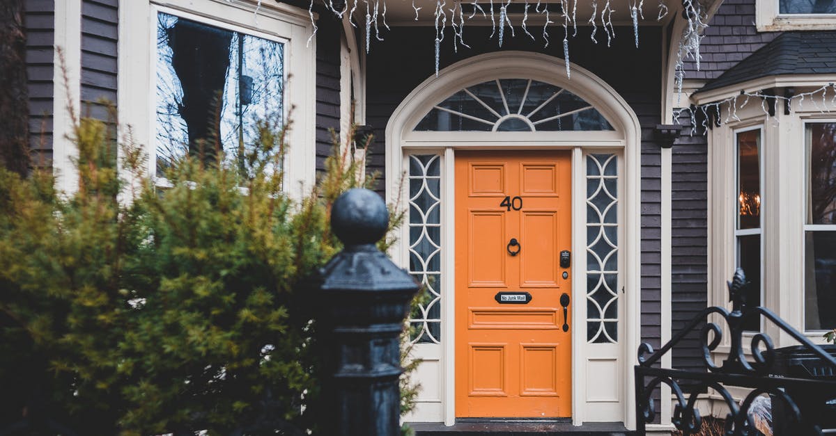 How to use a ridged cast iron griddle? - Exterior of contemporary wooden orange door and black cast iron gates to house How to use a ridged cast iron griddle? - Exterior of contemporary wooden orange door and black cast iron gates to house