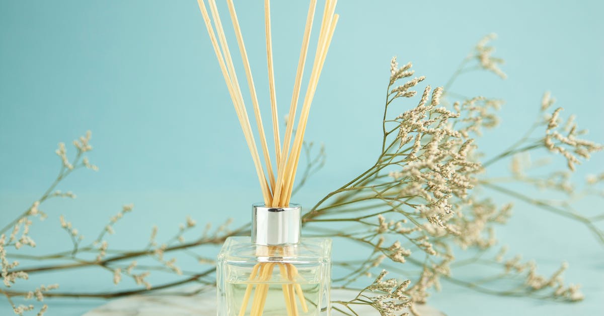 How to use herb extracts or essential oils in drinks - Perfume sticks near natural flowers How to use herb extracts or essential oils in drinks - Perfume sticks near natural flowers