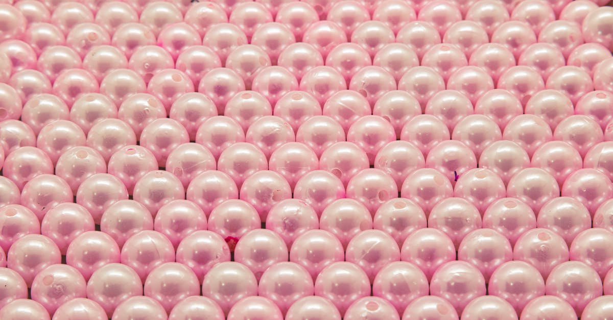 How to use tapioca pearls when making puddings and pies? - Pink and White Beads on Pink Textile How to use tapioca pearls when making puddings and pies? - Pink and White Beads on Pink Textile