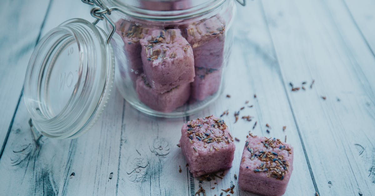 How to wash fresh fish properly to reduce its smell? - Aromatic purple bath bombs in glass jar arranged on white table How to wash fresh fish properly to reduce its smell? - Aromatic purple bath bombs in glass jar arranged on white table