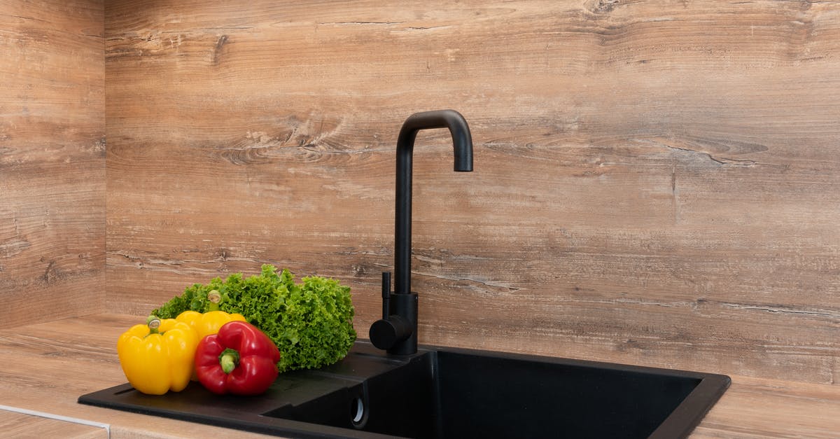 How to wash lettuce - Fresh green lettuce with red and yellow bell peppers placed near sink on wooden tabletop in modern kitchen How to wash lettuce - Fresh green lettuce with red and yellow bell peppers placed near sink on wooden tabletop in modern kitchen
