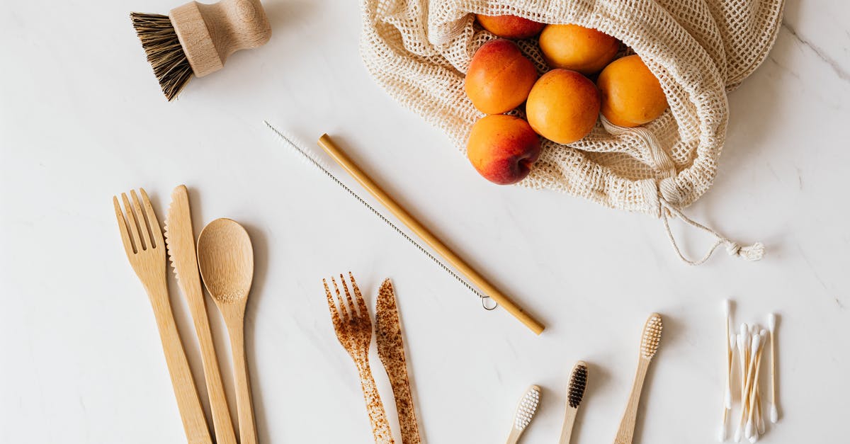 How to wash pesticides from fruit skins? - Bunch of delicious fresh peaches in cotton bag placed on table near wooden and plastic cutlery beside diverse wash accessories How to wash pesticides from fruit skins? - Bunch of delicious fresh peaches in cotton bag placed on table near wooden and plastic cutlery beside diverse wash accessories