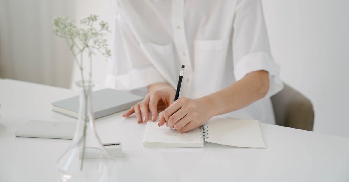 How to work with Dried Mushrooms? - Crop person writing in notebook at table How to work with Dried Mushrooms? - Crop person writing in notebook at table