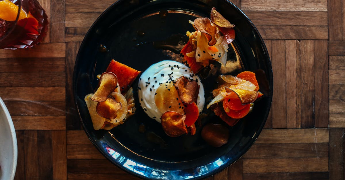 I have seaweed salad with sesame flavor. What are some good ways to garnish it or nice things to garnish with it? [closed] - Top view of platter with appetizing poached egg with mushrooms and vegetables sprinkled with black sesame seeds