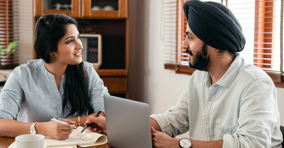 Ideas for using garlic scapes (other than in pesto)? - Indian male in turban and wristwatch typing on netbook while interacting with happy female coworker with notebook and pen sitting at table in office and looking at each other Ideas for using garlic scapes (other than in pesto)? - Indian male in turban and wristwatch typing on netbook while interacting with happy female coworker with notebook and pen sitting at table in office and looking at each other