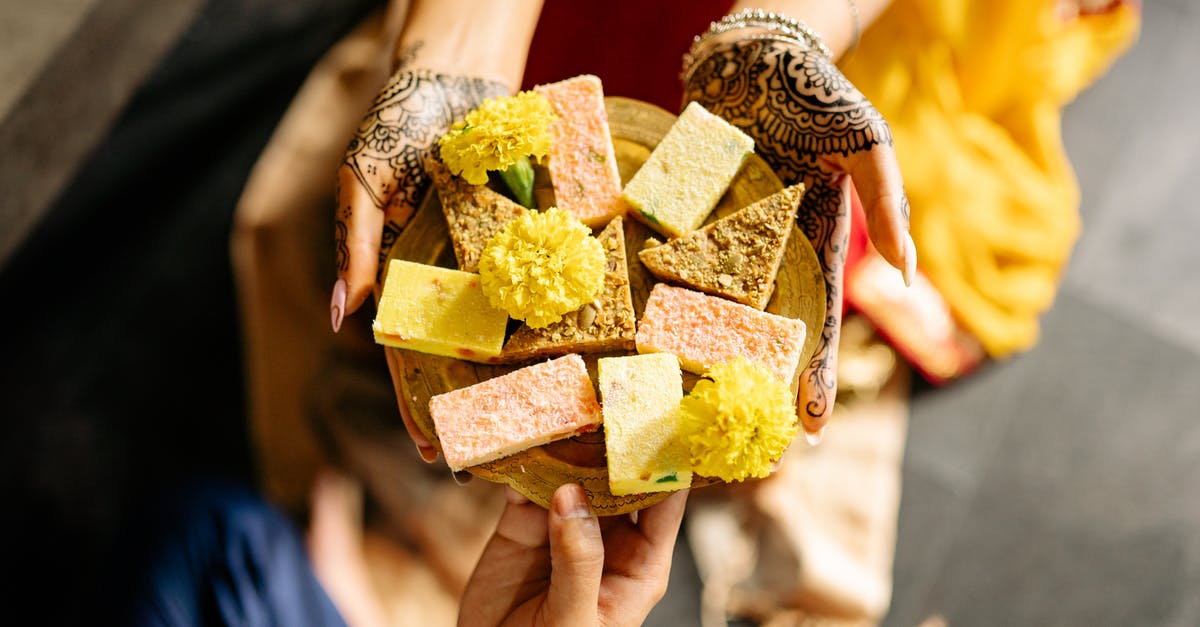 Identify this dessert - Person Holding Brown and Green Box Identify this dessert - Person Holding Brown and Green Box
