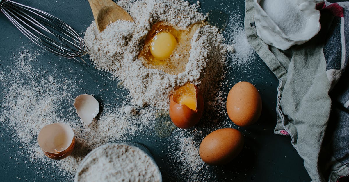 Identifying bulgur from cracked wheat - From above of broken eggs on flour pile scattered on table near salt sack and kitchenware Identifying bulgur from cracked wheat - From above of broken eggs on flour pile scattered on table near salt sack and kitchenware