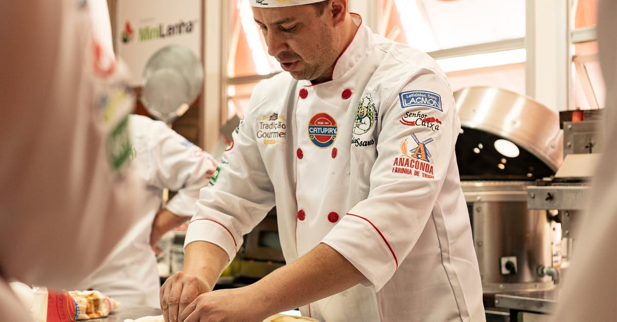 Identifying Strands of Dough - Man in White Chef Uniform Sitting on Chair