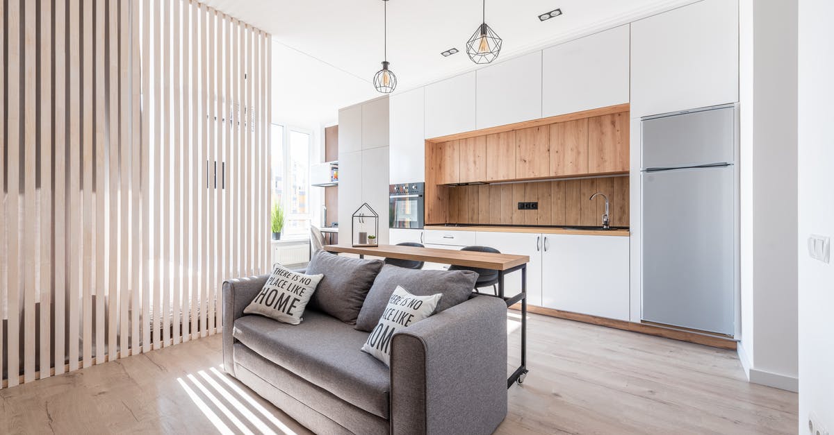 If a large can is divided into smaller containers, is it still shelf stable? - Interior of contemporary open plan kitchen with white cabinets and cozy sofa with cushions in sunlight If a large can is divided into smaller containers, is it still shelf stable? - Interior of contemporary open plan kitchen with white cabinets and cozy sofa with cushions in sunlight