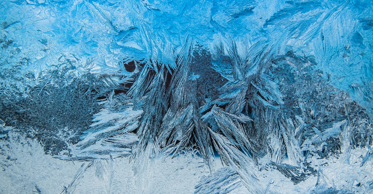 Improving texture of yogurt based ice cream- stabiliser? - Close-up of Ice Texture on Frozen Surface Improving texture of yogurt based ice cream- stabiliser? - Close-up of Ice Texture on Frozen Surface
