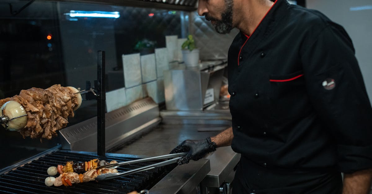 indoor grilling - A Man in Black Chef Jacket indoor grilling - A Man in Black Chef Jacket