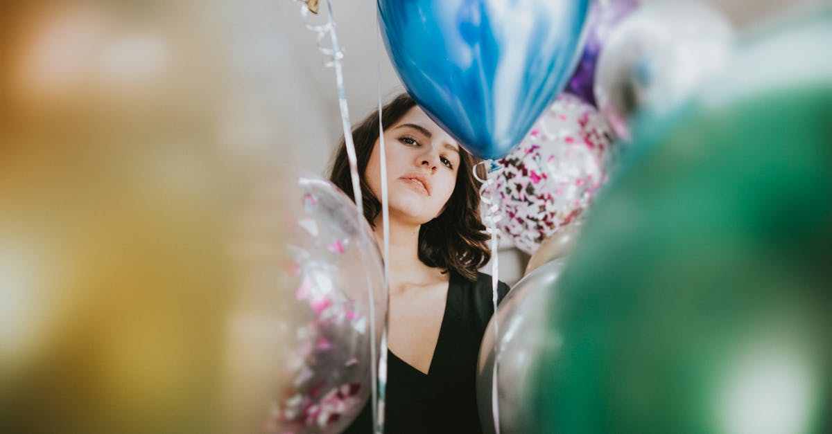 Inexpensive vacuum sealer not pulling out air - Woman Standing Near Balloons Inexpensive vacuum sealer not pulling out air - Woman Standing Near Balloons
