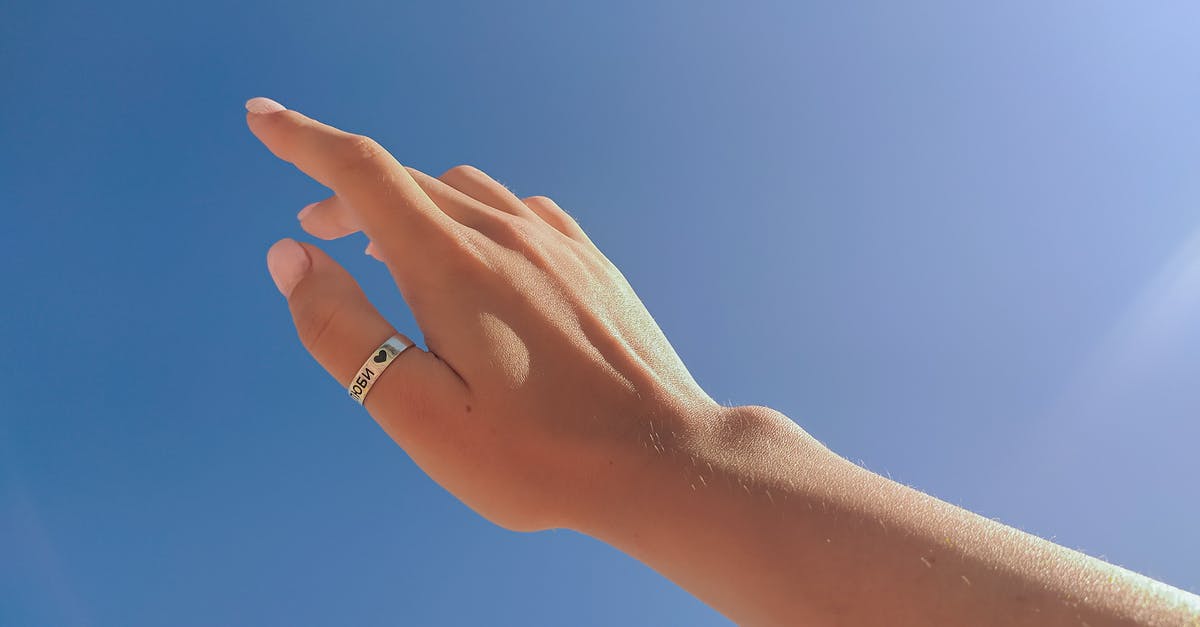 Inexpensive vacuum sealer not pulling out air - From below crop unrecognizable female hand with ring on thumb outstretched against cloudless blue sky on sunny day Inexpensive vacuum sealer not pulling out air - From below crop unrecognizable female hand with ring on thumb outstretched against cloudless blue sky on sunny day