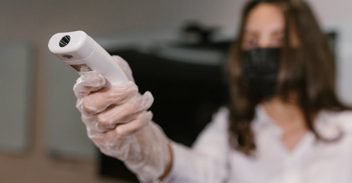 Infrared thermometer for oven temperatures - A Woman Holding an Infrared Thermometer Infrared thermometer for oven temperatures - A Woman Holding an Infrared Thermometer