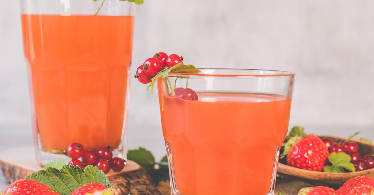 Ingredients for Cocktails - Two Clear Drinking Glasses With Strawberry Juice Ingredients for Cocktails - Two Clear Drinking Glasses With Strawberry Juice