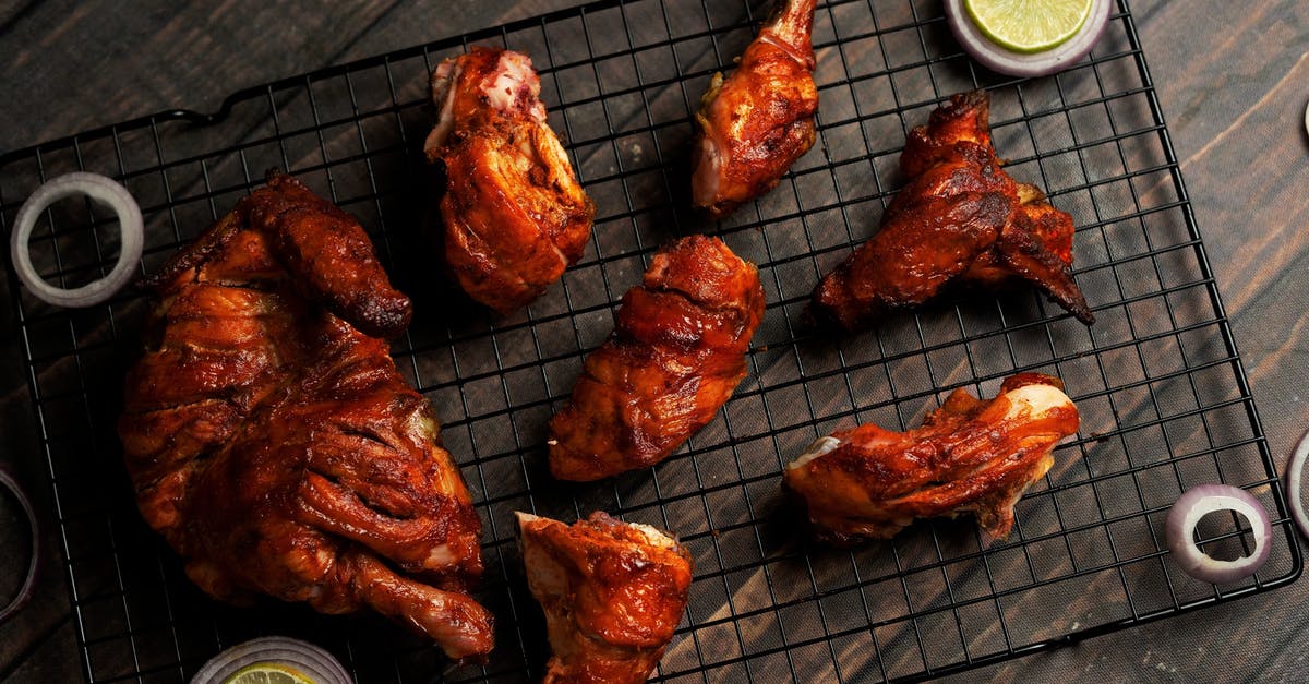 Injecting Jack Daniels into pork - Grilled Meat on Charcoal Grill Injecting Jack Daniels into pork - Grilled Meat on Charcoal Grill